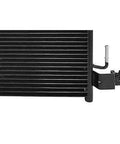 Upgrade Your Ride With This Heavy Duty Transmission Oil Cooler Perfect For The Nissan Titan XD From 2016 To 2019 Equipped With A 5.6L Engine Keeping Your Gearbox Cool And Reliable On The Road Without Overheating., black finned transmission oil cooler with mounting bracket and fitting