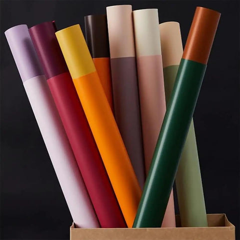 20 Sheets Flower Wrapping Paper Pack With 22 Inch Double Color Floral Bouquet Paper displaying colorful rolls in a box.