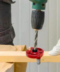 Pro Grade Drill Guide Locator with Vertical Self Centering Dowel Jig Kit in use, red aluminum, 3-10mm drill bushings