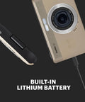 Compact Point And Shoot Camera With 13MP Sensor, 4x Digital Zoom, built-in lithium battery, tan finish, charging view.