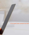 Close-up of 0.8mm thick aluminum metal card for laser engraving, black, 86 x 54 mm, showing its sturdy, non-bendable design