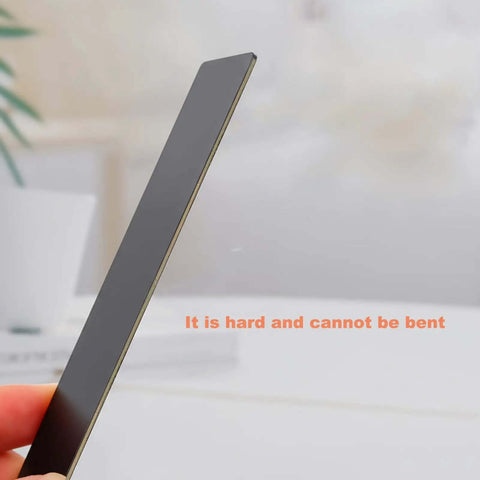 Close-up of 0.8mm thick aluminum metal card for laser engraving, black, 86 x 54 mm, showing its sturdy, non-bendable design