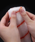 Hands holding a 10-inch microfiber foam paint roller from the 8Pcs 10 Inch Paint Rollers for Smooth Wall Makeover and Fresh Pattern Textures.