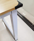 Heavy Duty Black Metal Corner Protectors Four Piece Set protecting furniture edge, featuring sleek black steel design on wooden table.