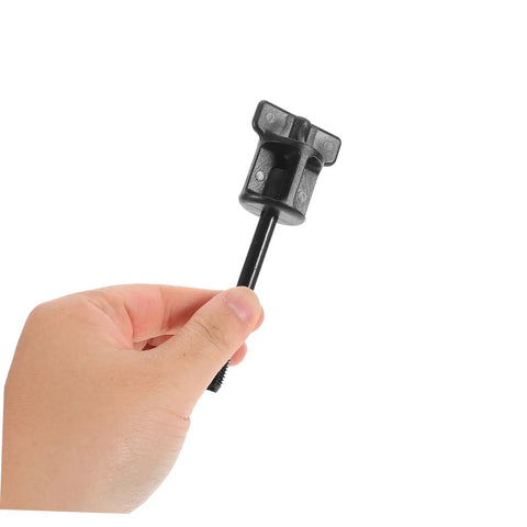 Hand holding Spare Tire Hold Down Screw Kit With Heavy Duty Mounting Hardware And Anchor Bolt For Secure Reliable Spare Tire Setup On Most Cars