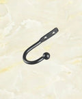 Hella Compact Black Metal Wall Hooks For Belts And Keys With Vintage Iron Curve Super Durable Purse Hangers, single hook design.