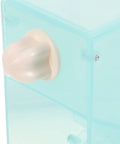 Close-up of No Fuss Splash Proof Bird Feeder Cage Mount with secure buckle clip, includes clear plastic design.