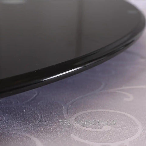Top Shelf Black Tempered Glass Lazy Susan Turntable 90cm Round Rotating Dining Tray showing smooth edge detail on a stylish surface.