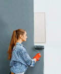Woman painting a wall near a Heavy Duty Metal Access Panel 18 X 24 Inch Spring Loaded Drywall Cover Touch Latch No Key Needed.