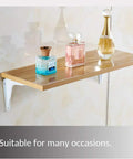 Rock Solid White Wall Mount Shelf Brackets Heavy Duty L Angle Furniture Supports Rust Resistant Waterproof Metal Hardware 2 Pack Indoor Outdoor Home Upgrade Essentials with perfume bottles on shelf.
