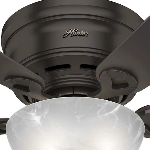 Close-up of 42 Inch Haskell Premier Bronze Low Profile Ceiling Fan With LED Light Kit And Pull Chain, marble glass cover visible.