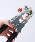 Hand holding Rugged Pro Grade Heavy Duty Welding Ground Clamp for Welder, Copper Electroplated Earth Clamp