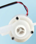 Top Notch 220V Water Pump Replacement For Household Small Bullet Ice Machine compatible with HZB50 HZB60 HZB80 showing white casing and wires.
