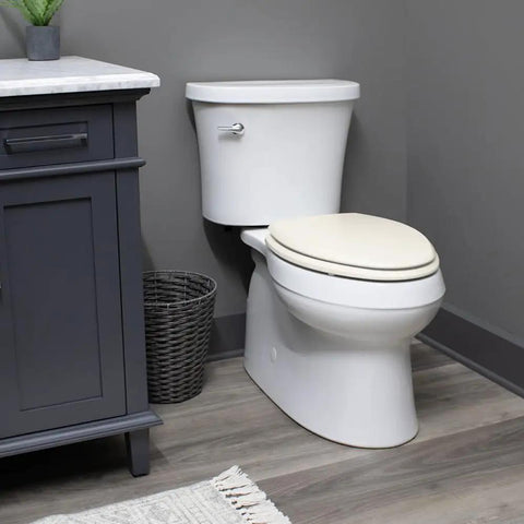 Premium Elongated Toilet Seat With Smooth Slow Close Lid Built Tough Durable Hardwood Frame No Slip Base Quick Snap Hinges Drop Dead Easy Mount Biscuit Color For Home Setup on a white toilet.