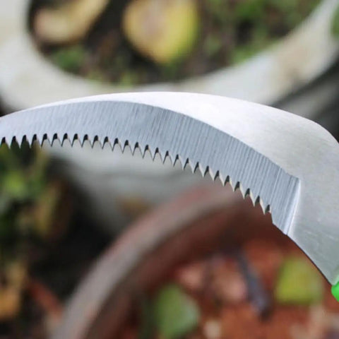 Close-up of serrated stainless steel blade of Handheld Weeding Tool With Serrated Edge For Grass Vines And Branches Durable