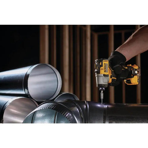 Xtreme 12V Max Cordless Impact Driver with 1 Quarter Inch Hex Chuck in use on metal pipe, industrial setting
