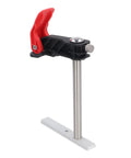 Close-up of a stainless steel quick release hold down clamp with red grip for woodworking, showing T-slot fitting mechanism.