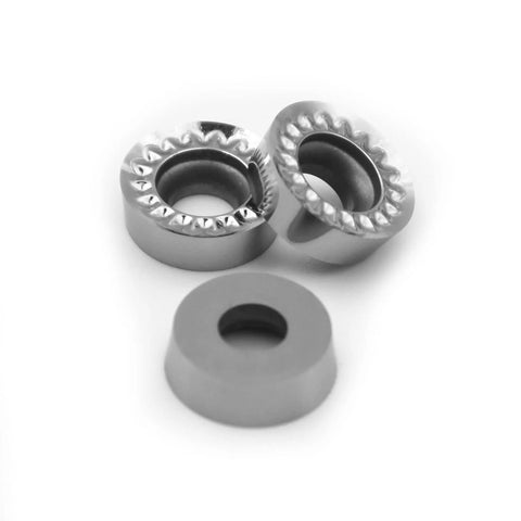 Front view: two silver aluminum R5 round turning inserts with serrated outer edge and central bore; gray spacer.