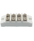 Four-position ceramic high-current terminal block with four screw terminals on a white base