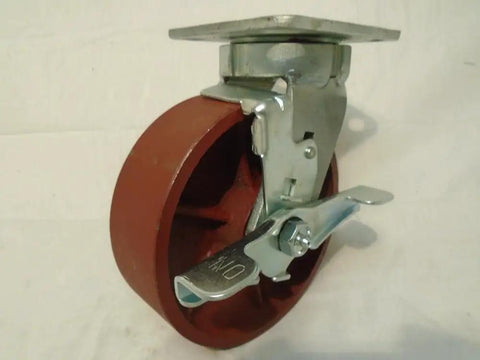 Six Inch Heavy Duty Ductile Steel Caster Set Kingpinless Wheel Brakes with red rubber tread and swivel locking mechanism.