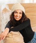 Woman wearing Satin Lined Beanie For Curly Hair Women Cozy Cable Knit Winter Hat With Frizz Free Moisture Retaining Satin Interior Curly Girl Method Approved Keeps Curls Defined And Hair Happy All Winter