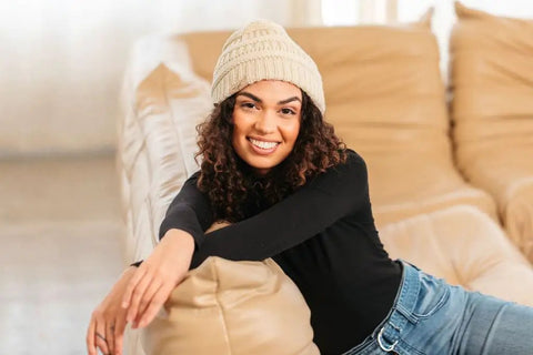 Woman wearing Satin Lined Beanie For Curly Hair Women Cozy Cable Knit Winter Hat With Frizz Free Moisture Retaining Satin Interior Curly Girl Method Approved Keeps Curls Defined And Hair Happy All Winter