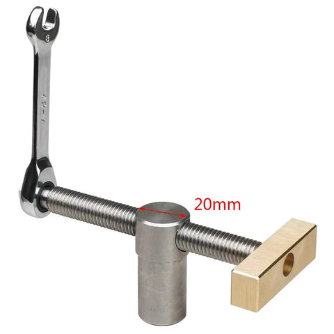 Professional Grade Woodworking Table Vise With Tenon Stop Strip Rock Steady Bench Fixture For Hardcore Carpenter And Machinist Shop Rig Built Tough Brass Workshop Clamp showing 20mm steel jaws and brass detail.