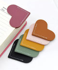 Six Piece Genuine Leather Heart Corner Bookmarks For Real Deal Bookworms And Teachers Handcrafted Page Holders arranged on a notepad.