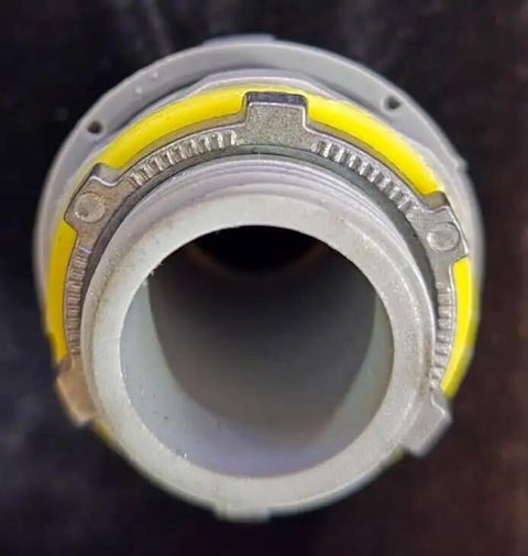 Solid Grip Eight Piece 1 Inch PVC Liquidtight Straight Conduit Fittings For Flexible Electrical Wiring With Steel Locknuts And Tight Seal Gaskets showing detailed view of a connector with yellow seals.