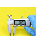 Measuring Heavy Duty Hybrid Ceramic Bearings 8x16x5mm Abec-1 with caliper showing 8.00mm reading on yellow background.