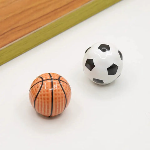 Solid Ceramic Soccer Knobs Four Pack Football Drawer Handles For Kids Bedroom And Man Cave Sports Decor Dresser Cabinet Pulls Easy Install Badass Home Gear, featuring a soccer and basketball knob.