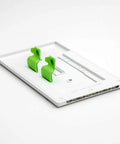 2 Pack LED Night Light For Single Pole Switches With Auto On Off Sensor white base with green clips on a white background.
