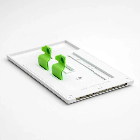 2 Pack LED Night Light For Single Pole Switches With Auto On Off Sensor white base with green clips on a white background.
