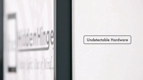 Close-up of Hella Easy Invisible Picture Frame Hinges For Wall Safes showing undetectable hardware on a white wall.