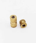Brass Knurled Insert Nuts Metric Thread For DIY Projects Plus 25pc Assortment M2.5 M3 round column nuts view on white background.