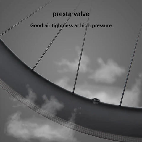 Close-up of Ultra Light 700C Carbon Road Wheelset With 38mm Rim V Brake Clincher showing presta valve and spokes