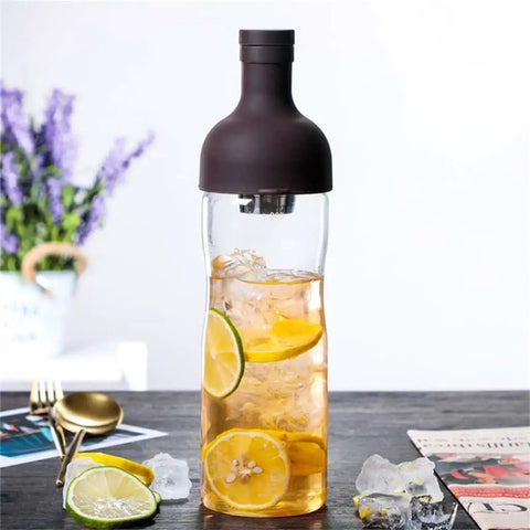 This Straight Up Game Changing 800 Ml Cold Brew Coffee Maker Doubles As A Portable Iced Espresso Glass Bottle With Leakproof Tea Infuser Designed For Boss Level Chilled Sips Anywhere You Head filled with iced tea and citrus slices.