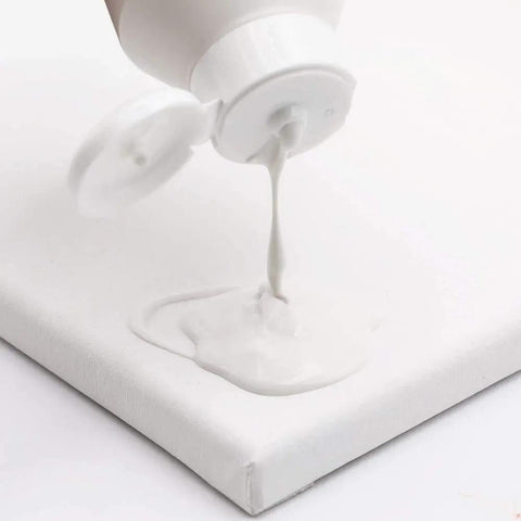 Premium White Texture Gesso 250ml for Artists being poured onto canvas creating smooth surface for mixed media