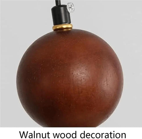 Detail of Travertine Pendant Light Spherical Walnut Wood Hanging Lamp Natural Stone modern fixture with gold accent.