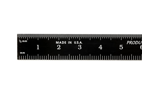 Kickass Flexible Metric Metal Ruler With Matte Black Chrome Coating and Heavy Duty Tempered Stainless Steel Frame displayed showing metric readings.