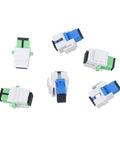 Ten Pack Fiber Optic SC To SC APC Simplex Couplers For Singlemode Cables with white keystone jack adapters on white surface