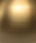 Close-up view of the brushed brass finish of the 27 Inch Tall Arc Table Lamp With Seeded Glass Shade In Brushed Brass Finish For Home Or Office Desk Reading And Task Lighting Ideal For Nightstands And Side Tables A Classic Yet Modern Accent Lamp For Your Setup.