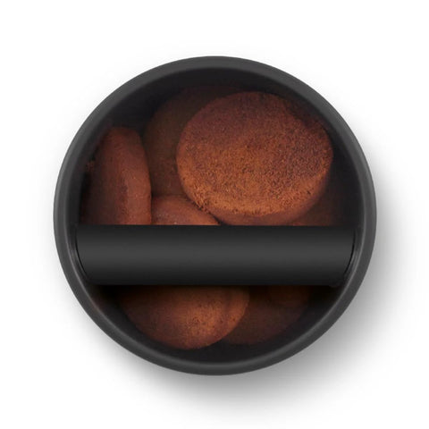Breville BEA501BSS knock box in brushed stainless steel with coffee pucks inside
