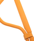Close-up of the bright orange frame of the Foldable Scarf Organizer Rack With 18 Slots For Closet Storage And Necktie Display.
