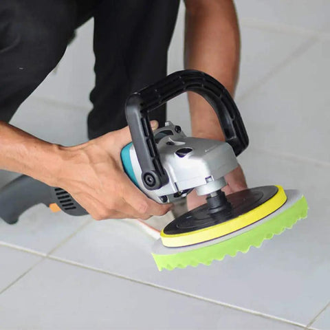 Person using Car Detailing Drill Polishing Pad Kit With 39 Pcs on a floor, focusing on foam polisher attached to a drill handle.