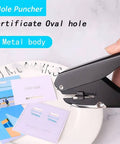 Metal Oval Single Hole Punch 4 15mm Hole Puncher with Lever Action in use on paper, durable metal body, punches up to 10 sheets