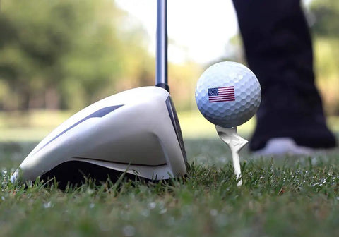Close-up of a golf ball on Diamond Golf Tees That Cut Spin For Longer, Straighter Drives And Zero Friction Feel, 3.25 Inch Tees