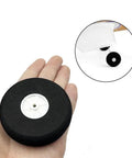 Hand holding 4 Pcs 2.75 Inch RC Airplane Wheels Set With Light Foam Tires Pro Grade Ultra Lightweight Sponge Wheels for planes