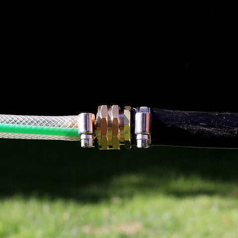Solid Brass Garden Hose Repair Kit with Stainless Steel Clamps, hose connection outdoors showing fittings and clamps in focus.