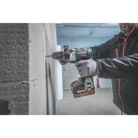 Professional Heavy Hitter 18V Brushless Cordless Hammer Drill Driver Set Includes Two 52Ah Lithium Ion Batteries Quick Charger in action drilling through a wall.
